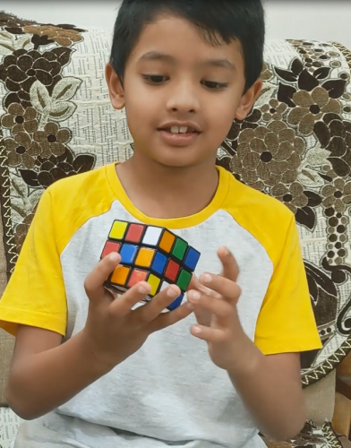 Grade II Student Akshaj solving rubik's cube Talent show